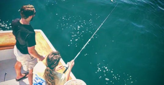 Couple enjoying deep sea fishing in Destin, Florida
